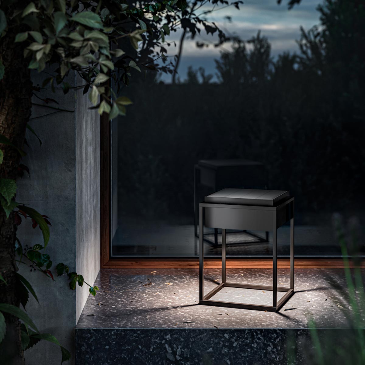 Qua Outdoor LED Solar Portable Table Lamp in Outside Area.