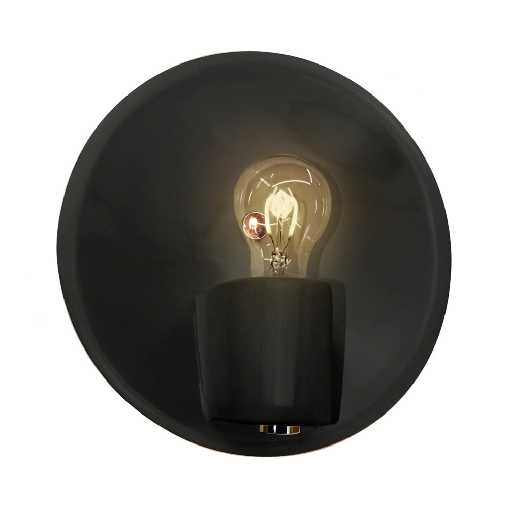 Ambiance Shield Wall Light in Carbon Matte Black/Polished Brass.