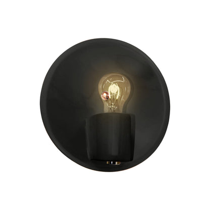 Shield Wall Light in Carbon Matte Black/Polished Brass.