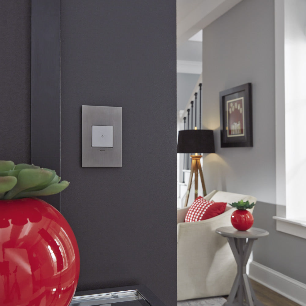 adorne® Cast Metals Wall Plate in living room.