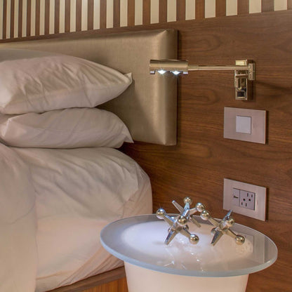 adorne® Cast Metals Wall Plate in bedroom.