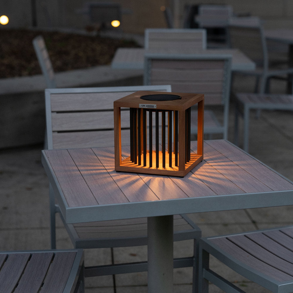 Akin Outdoor Solar LED Table Lamp in Outside Area.