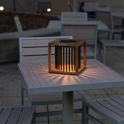 Akin Outdoor Solar LED Table Lamp in Outside Area.