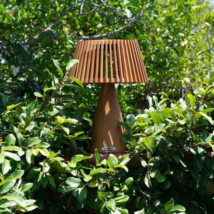 Enoki Outdoor Solar LED Table Lamp in Outside Area.