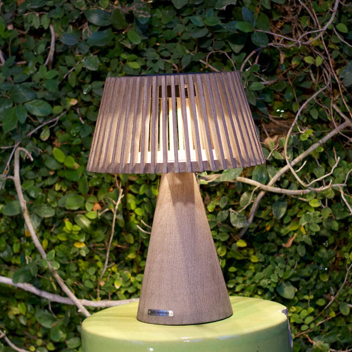 Enoki Outdoor Solar LED Table Lamp in Outside Area.