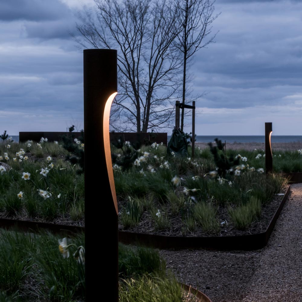 Flindt Garden Tall Outdoor LED Bollard in Outside Area.