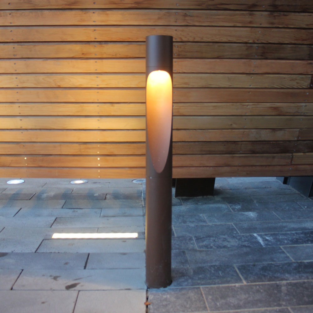 Flindt Garden Tall Outdoor LED Bollard in Outside Area.