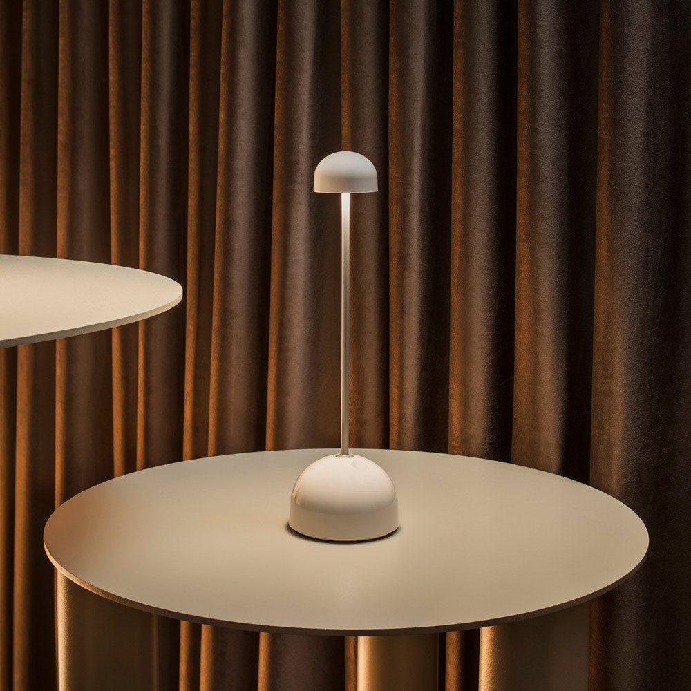 Sips Outdoor LED Potable Table Lamp in restaurant.