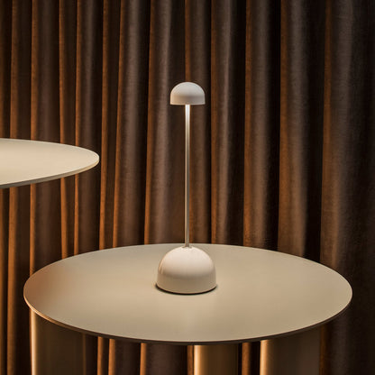 Sips Outdoor LED Potable Table Lamp in restaurant.