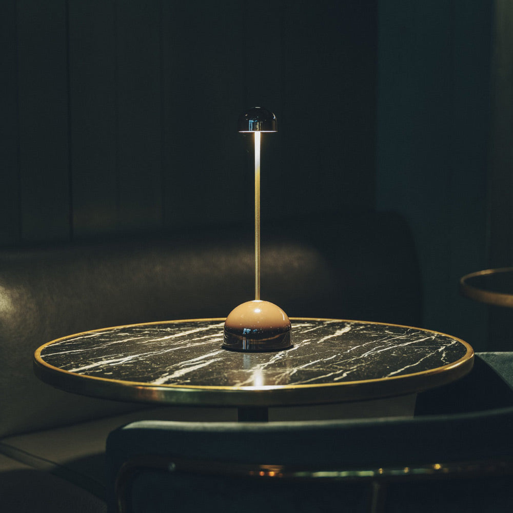 Sips Outdoor LED Potable Table Lamp in living room.