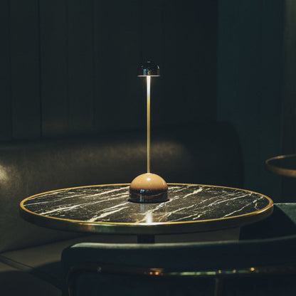 Sips Outdoor LED Potable Table Lamp in living room.