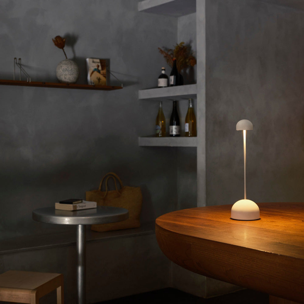 Sips Outdoor LED Potable Table Lamp in dining room.