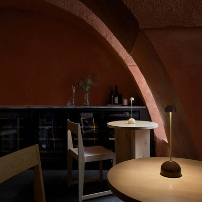 Sips Outdoor LED Potable Table Lamp in restaurant.