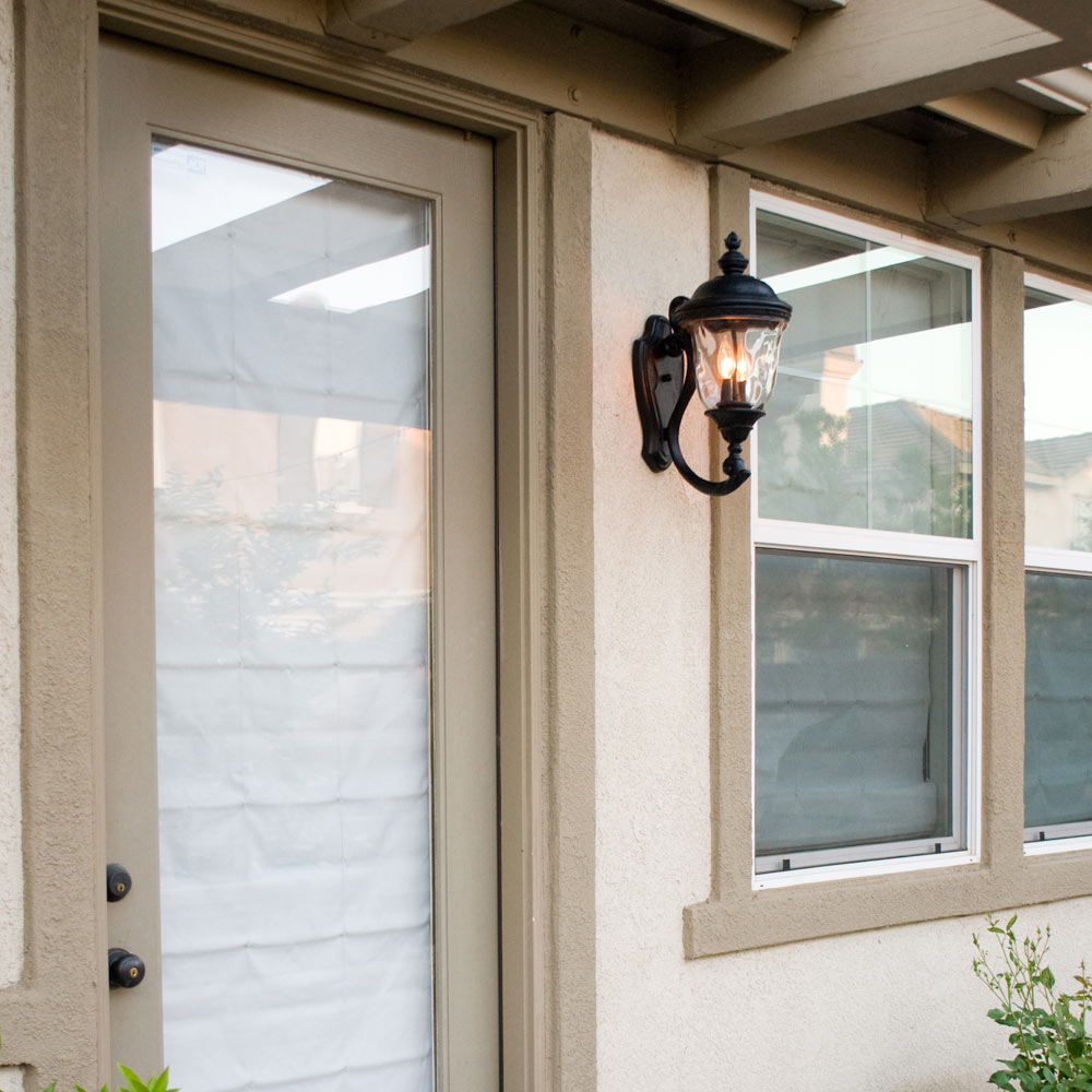 Carriage House Outdoor Clear Glass Wall Light in Outside Area.