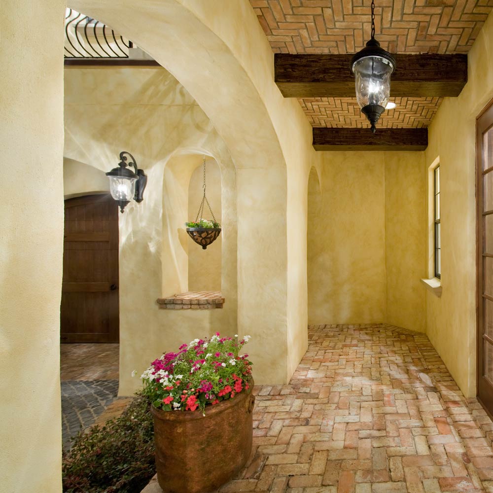 Carriage House Outdoor Glass Lantern Wall Light in Outside Area.