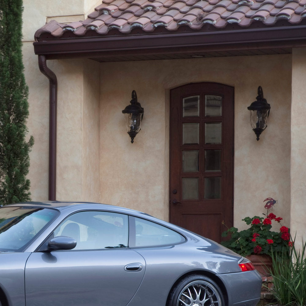 Carriage House Outdoor Glass Lantern Wall Light in Outside Area.