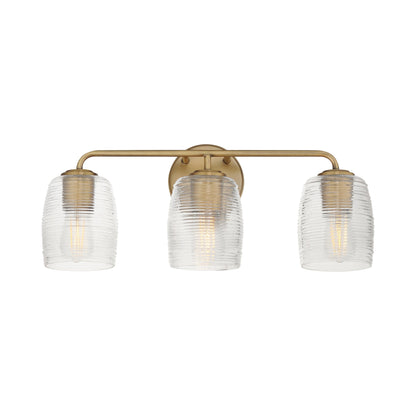 Honey Bath Vanity Light in Natural Aged Brass (3-Light).