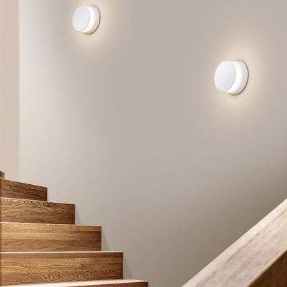 Totem Puck LED Wall Light in stairway.