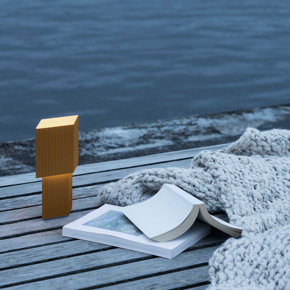 Romb Mini LED Rechargeable Table Lamp in Outside Area.