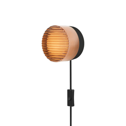 Crisp LED Plug-In Wall Light in Copper Exterior/Black Anodized.
