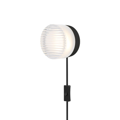 Crisp LED Plug-In Wall Light in Frosted/Black Anodized.