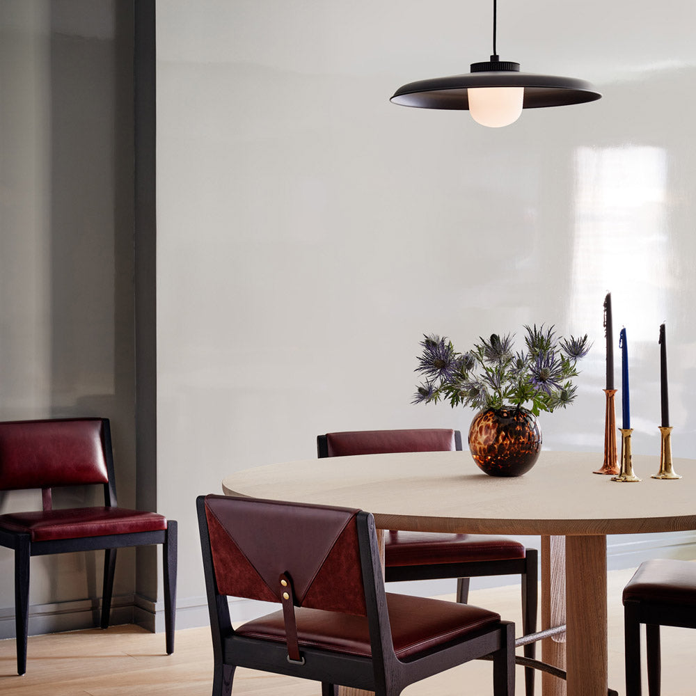Hoist Shade LED Pendant Light in living room.