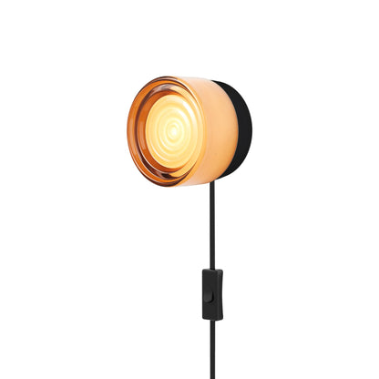 Ripple LED Plug-in Wall Light in Copper Exterior/Black Anodized.