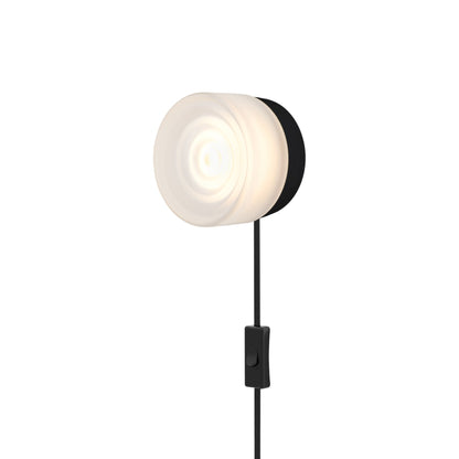Ripple LED Plug-in Wall Light in Frosted/Black Anodized.