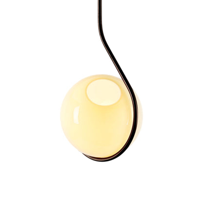 Fiddlehead Pendant Light in Bronze/Cream.