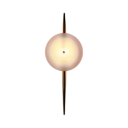 The Laddi Round LED Wall Light in Polished Unlacquered Brass.