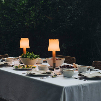 Básica Mini LED Rechargeable Table Lamp in dining room.