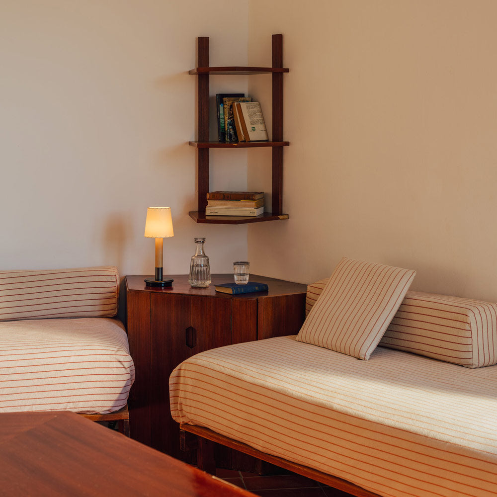 Básica Mini LED Rechargeable Table Lamp in living room.