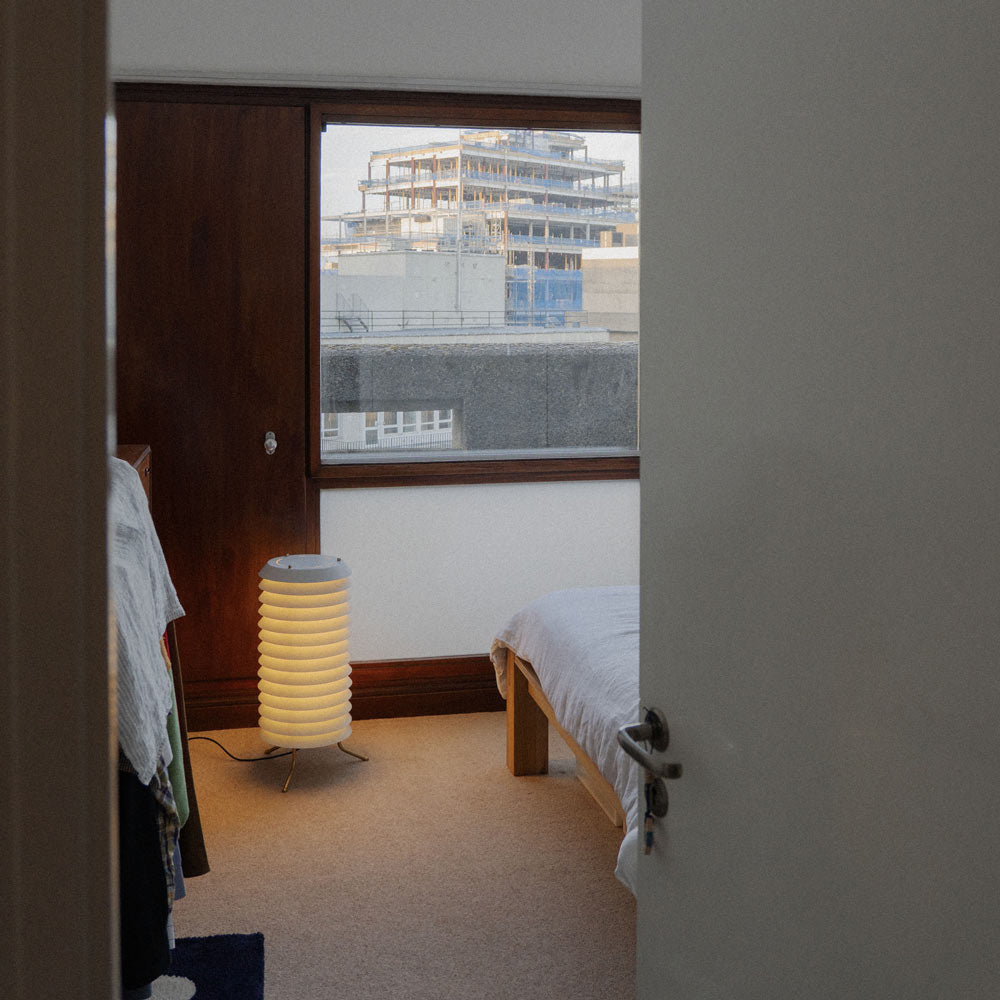 Maija LED Floor Lamp in bedroom.
