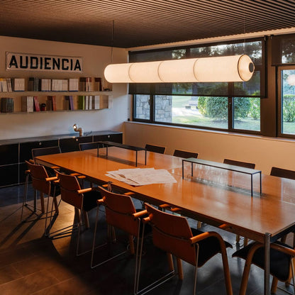Tekiò Horizontal LED Pendant Light in meeting room.