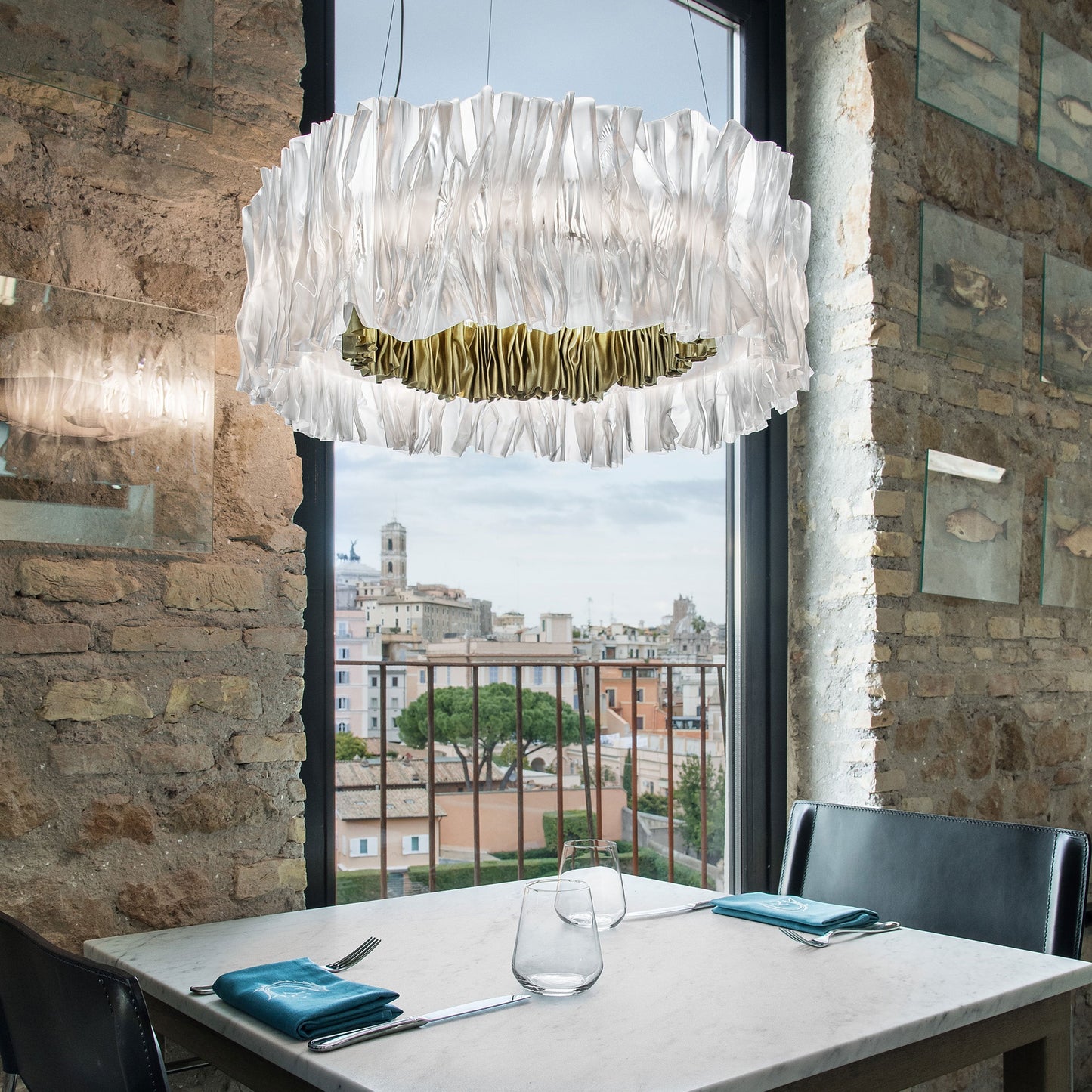 Accordeon LED Chandelier in dining room.