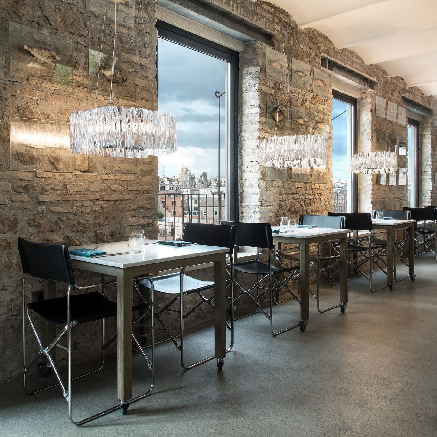 Accordeon LED Chandelier in dining room.