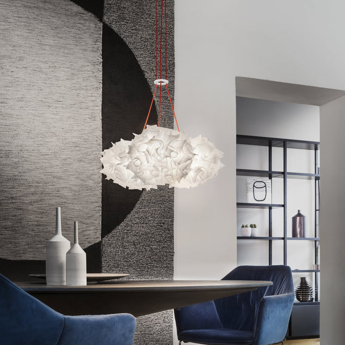 Veli Mini Trio Couture LED Pendant Light in living room.