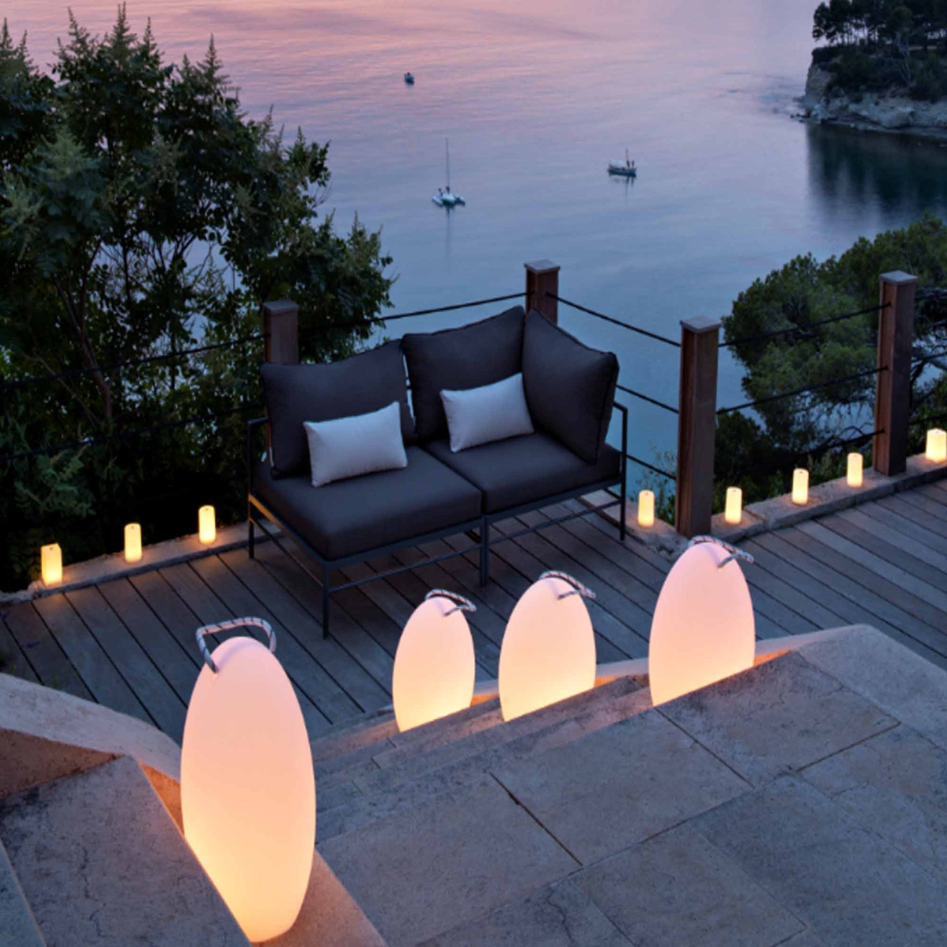 Amanda Corde Bluetooth Outdoor LED Table Lamp in Outside Area.