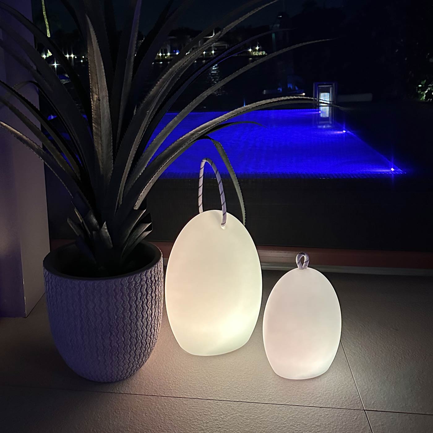 Amanda Corde Bluetooth Outdoor LED Table Lamp in Outside Area.