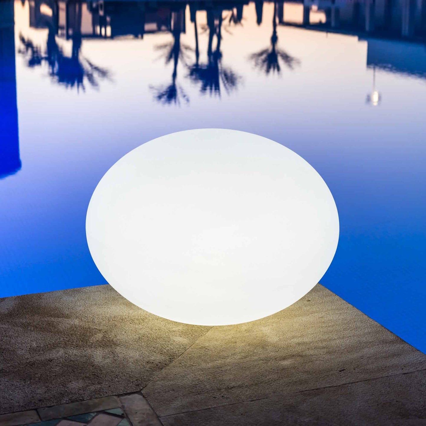 Flatball Floating Bluetooth Outdoor LED Lamp in Outside Area.