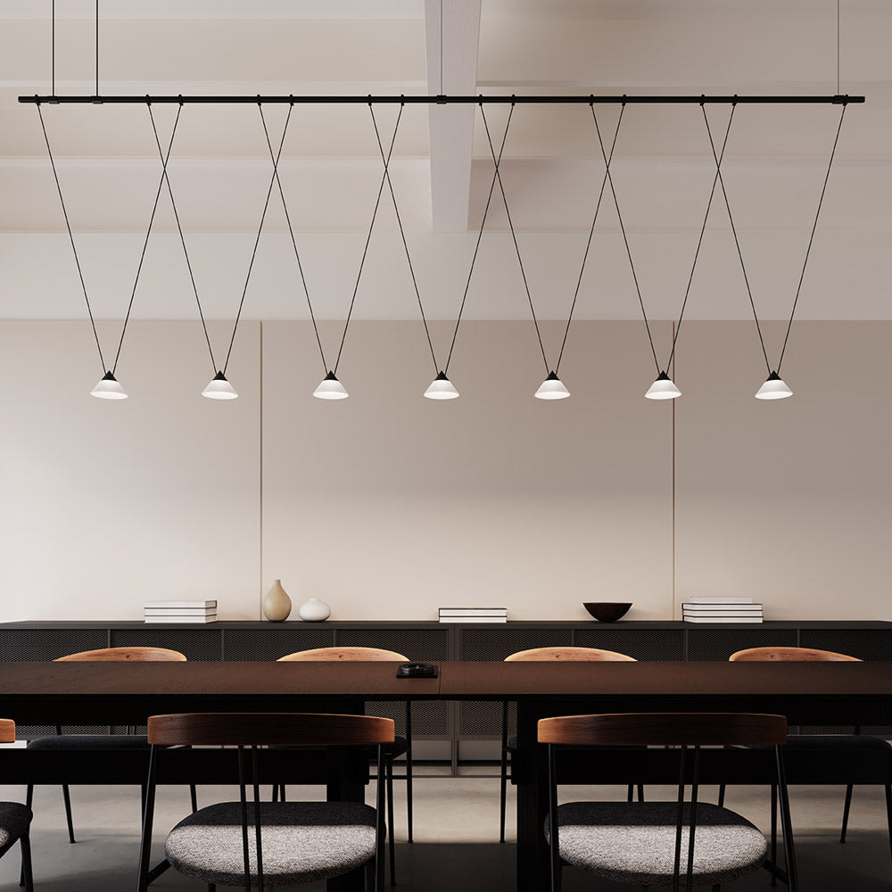 Suspenders® Tier Linear LED Pendant Light in dining room.