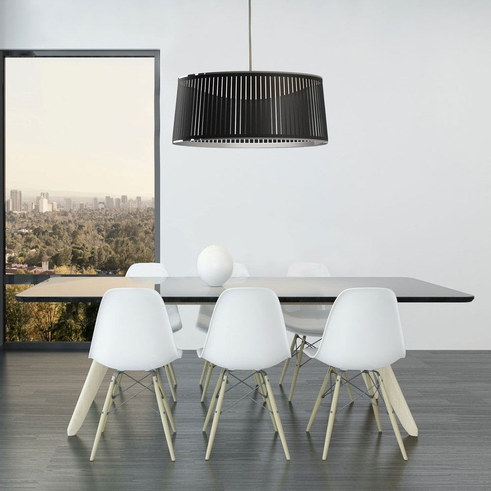 black drum pendant light over dining table