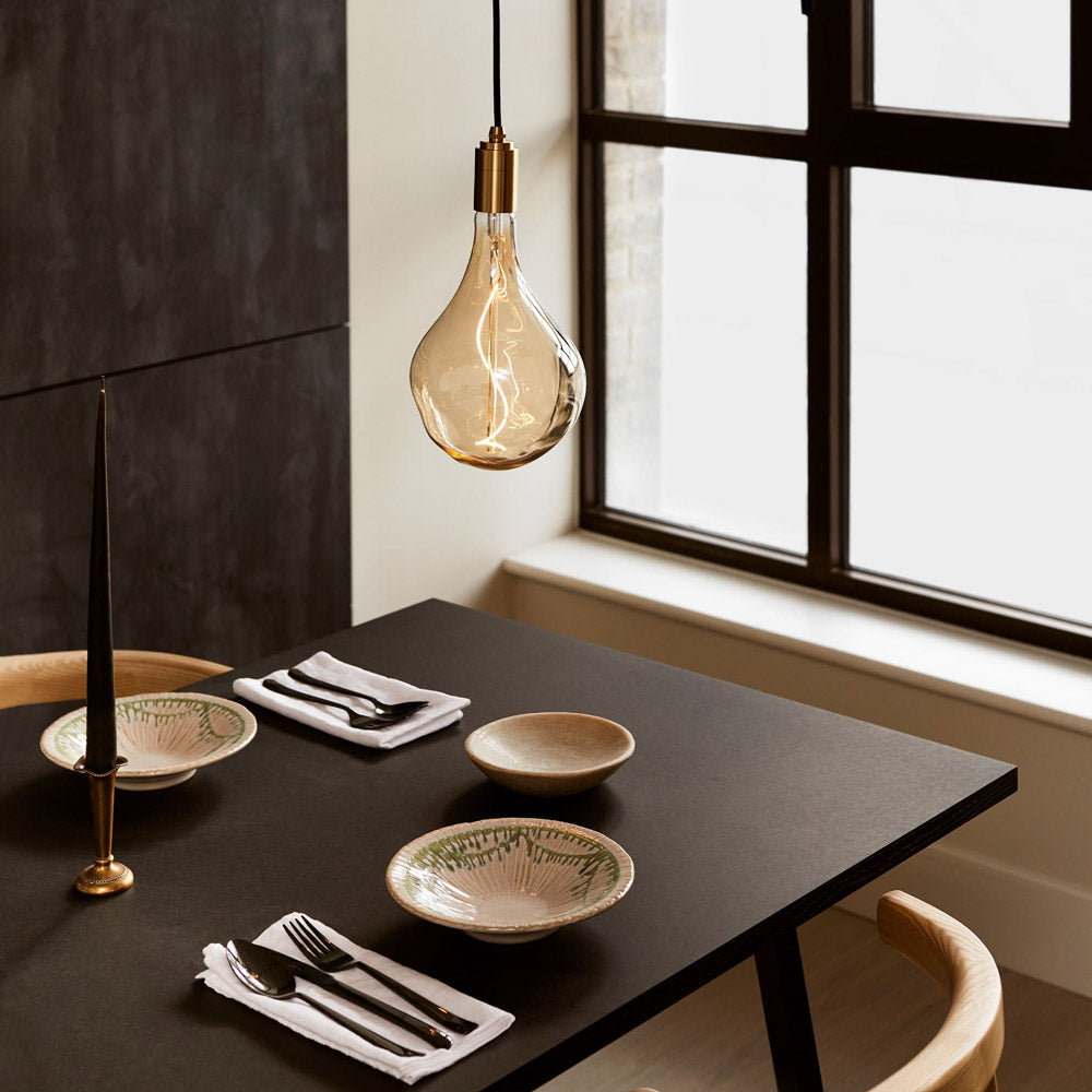 Cylindrical Pendant Light in dining room.