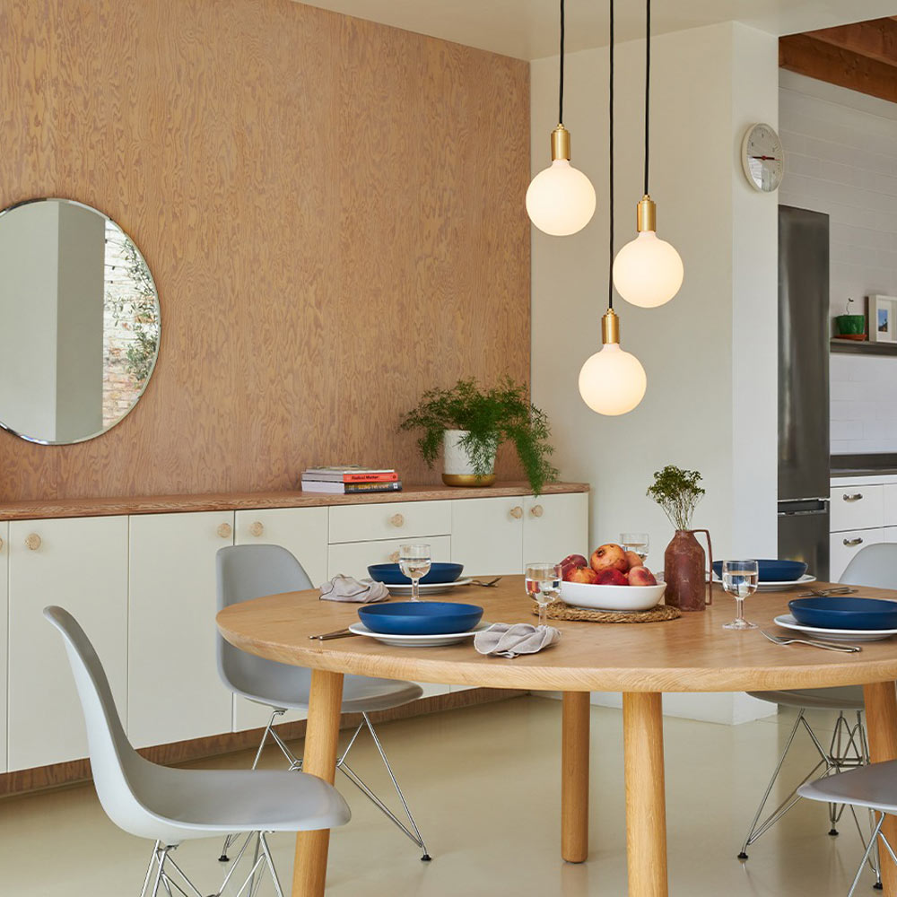 Sphere IV Triple Pendant Light in living room.