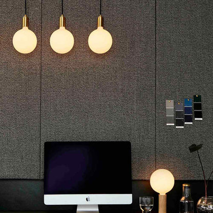 Sphere V LED Linear Triple Pendant Light in living room.