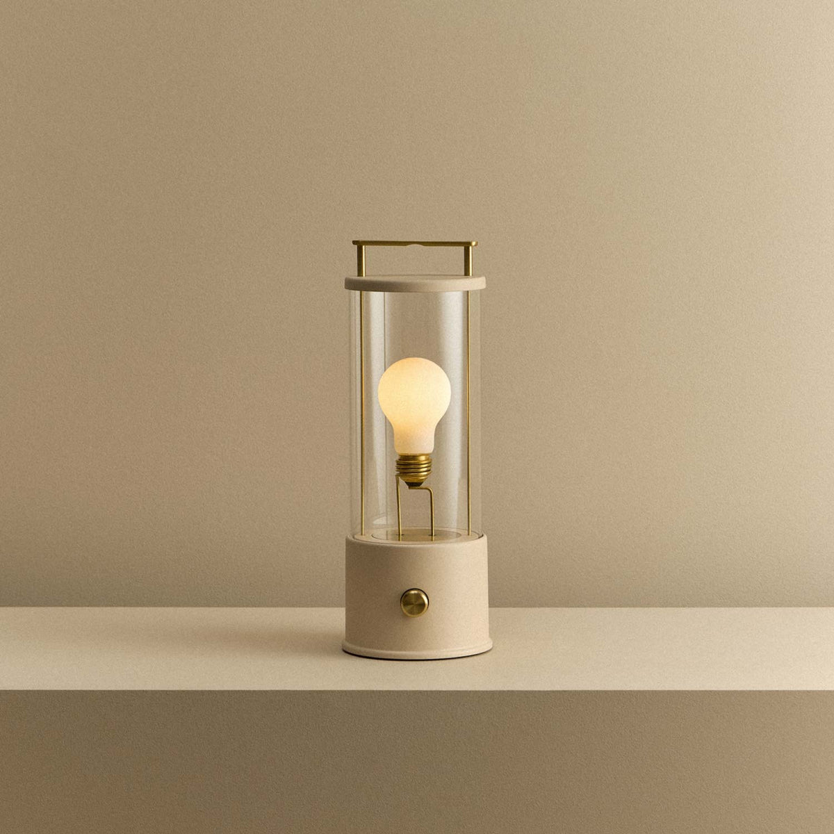 The Muse 2.0 Portable Table Lamp in Setting Plaster Pink.