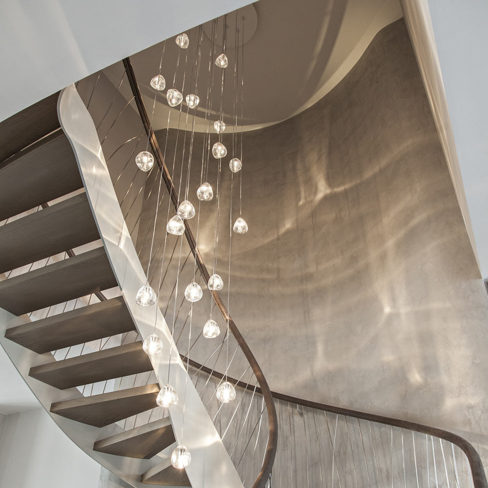 Mizu Round Multi Light Pendant Light in stairway.
