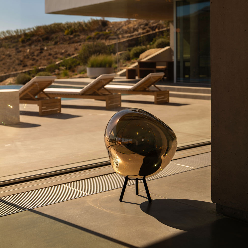 Melt Portable LED Floor Lamp in Outside Area.