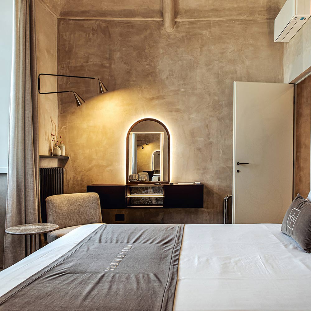 Gordon 2-Light Orientable Wall Light in bedroom.