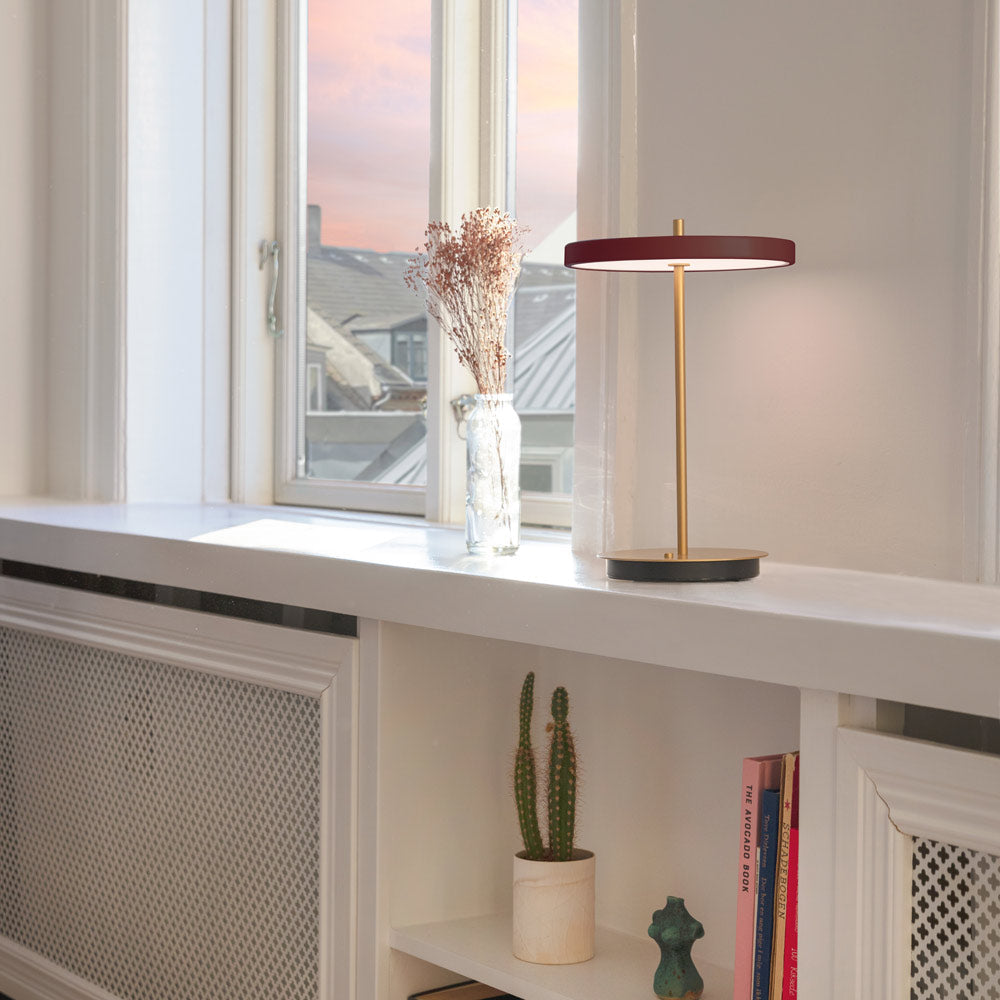 Asteria Move LED Portable Table Lamp in living room.